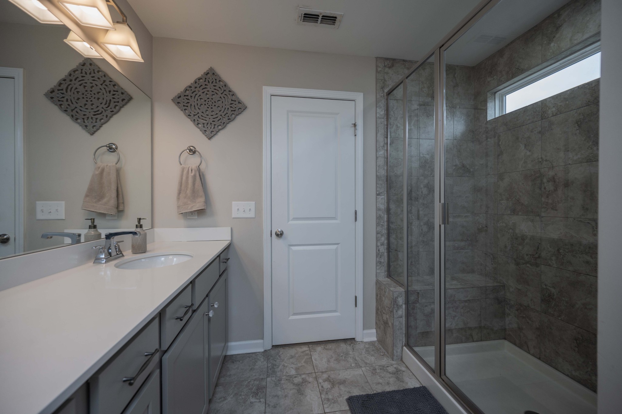 416 Butler Road Mount Juliet, TN 37122 - Photo 30 of 46 a bathroom with a double vanity sink mirror and shower