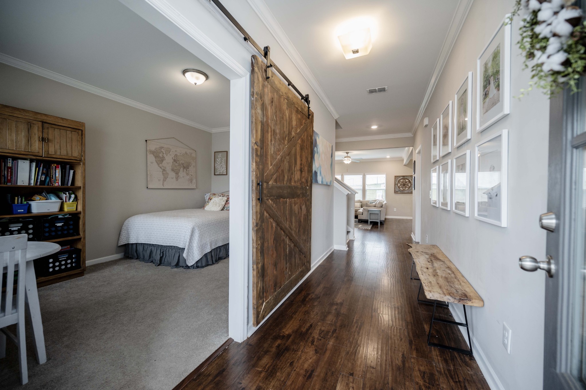 416 Butler Road Mount Juliet, TN 37122 - Photo 3 of 46 a view of a bedroom with wooden floor and windows