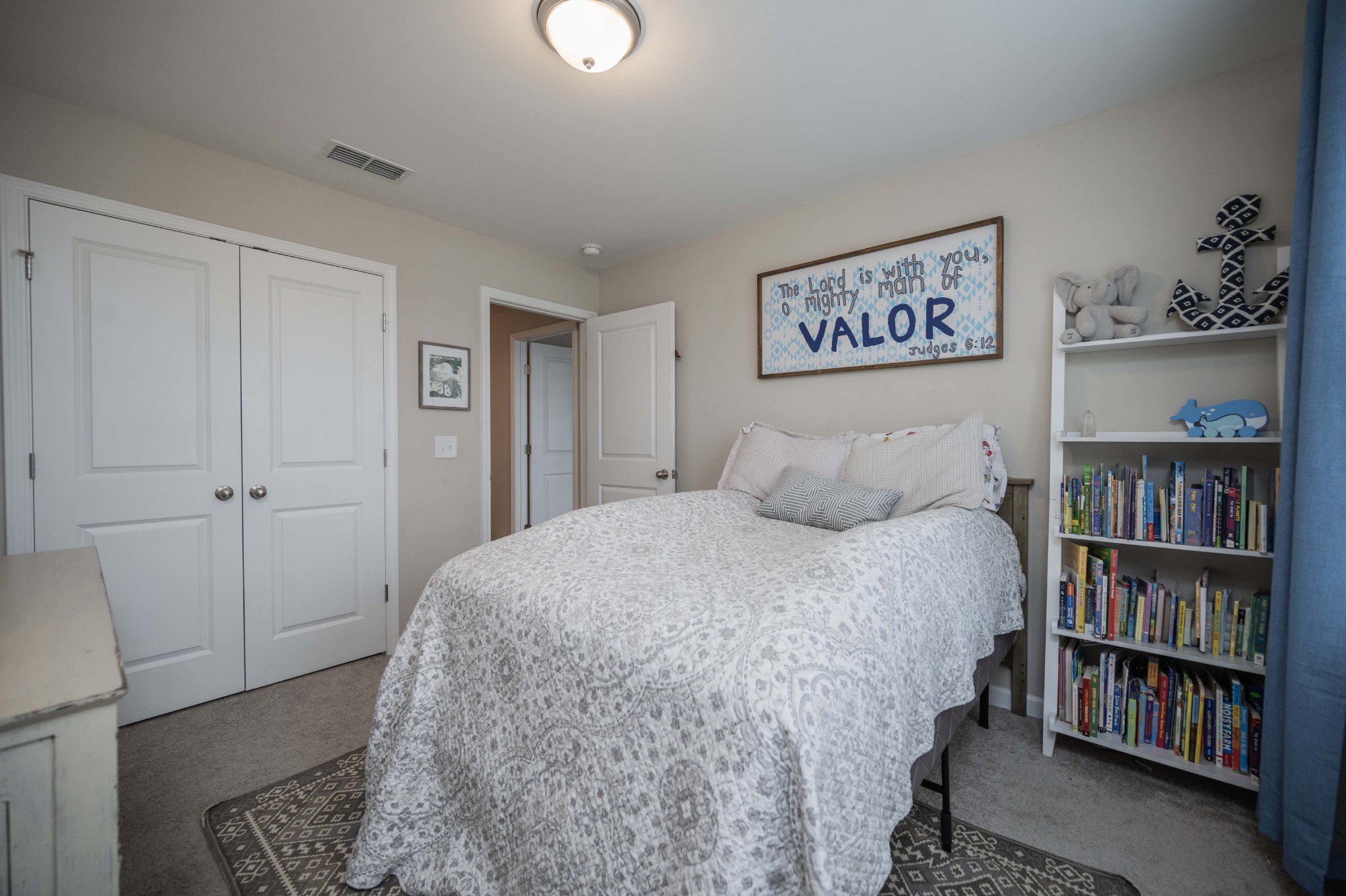 416 Butler Road Mount Juliet, TN 37122 - Photo 38 of 46 a bedroom with a bed and a book shelf