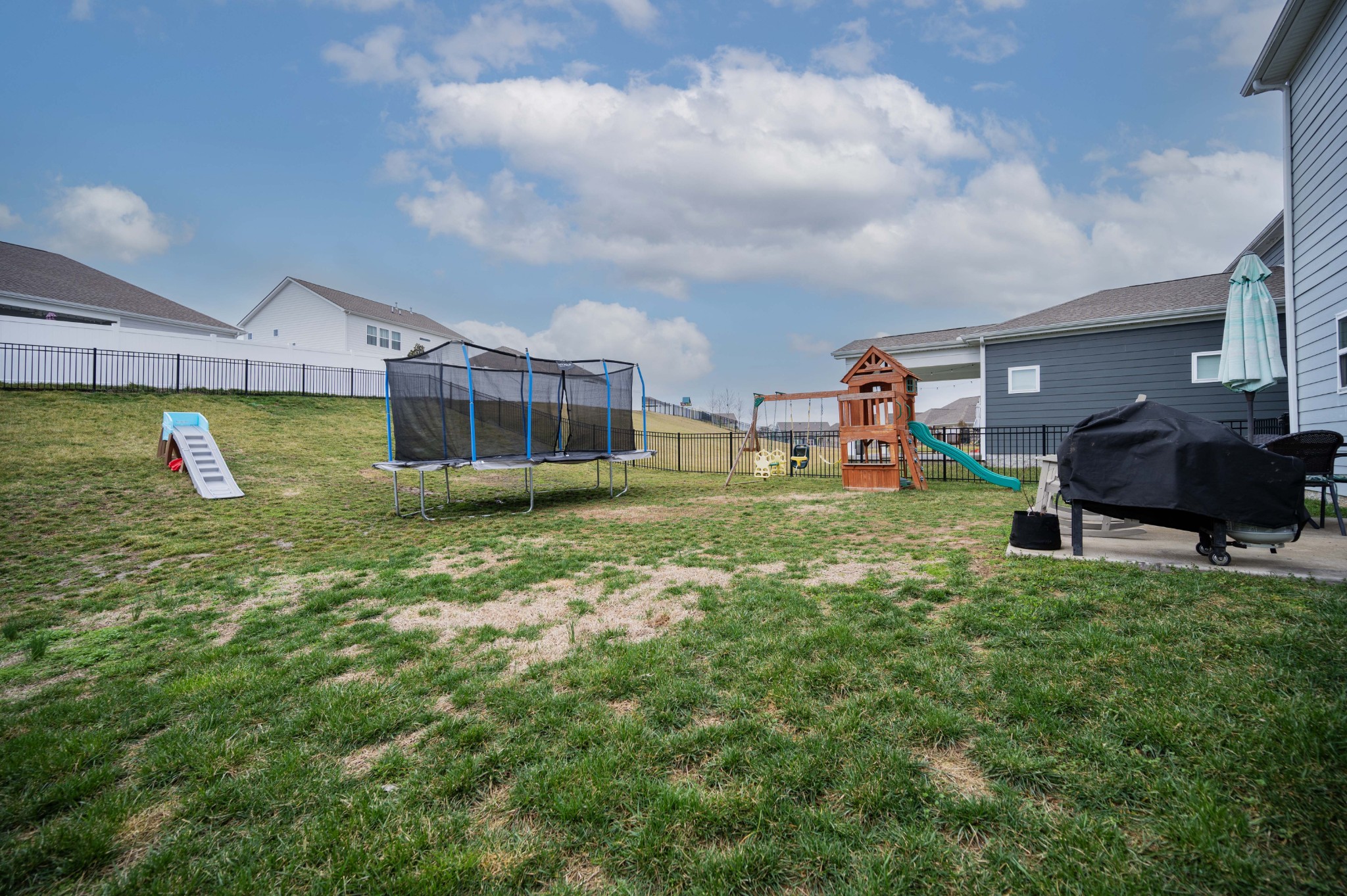 416 Butler Road Mount Juliet, TN 37122 - Photo 41 of 46 a view of a big yard with table and chairs under an umbrella