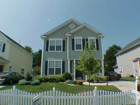5013 Dawn Piper Drive Raleigh, NC 27613 - Photo 1 of 1 a front view of a house with a yard