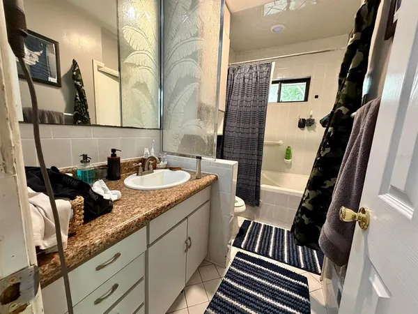 a bathroom with sink and mirror
