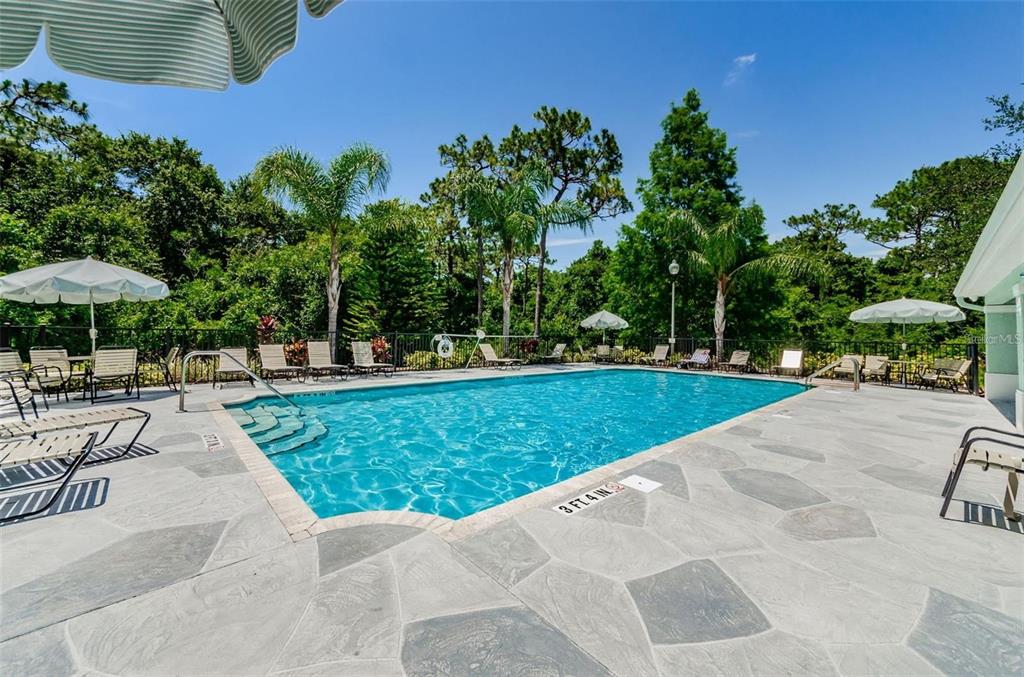 5310 Anhinga Trail New Port Richey, FL 34653 - Photo 24 of 27 a view of outdoor space yard deck patio and outdoor kitchen