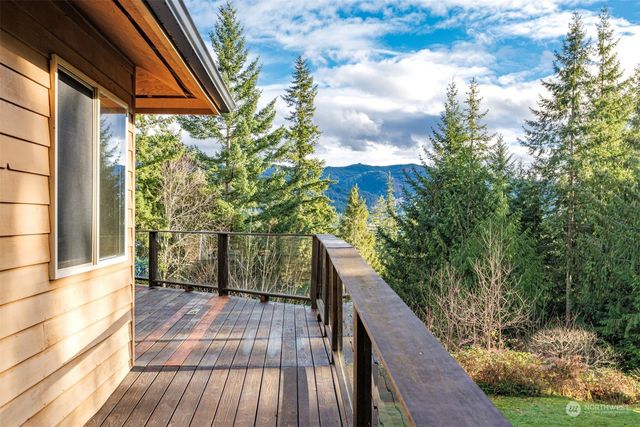 a view of balcony with wooden floor and fence