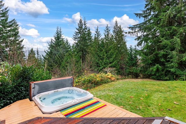 a view of a backyard with sitting area