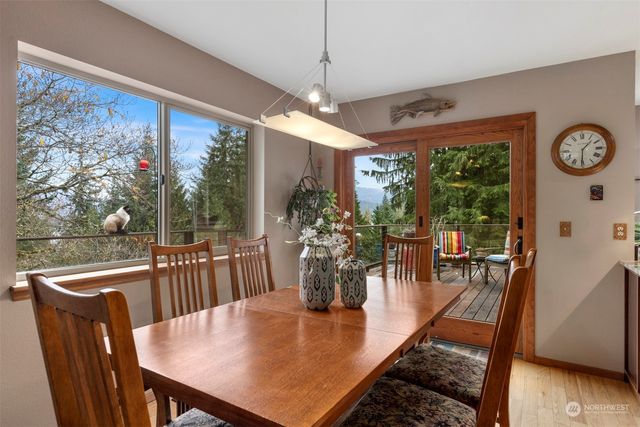 a view of a dining room with furniture window and outside view