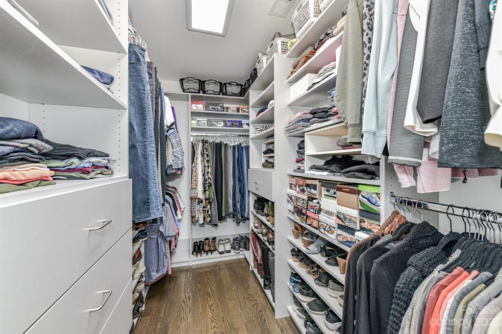 21311 Summerbrook Drive Cornelius, NC 28031 - Photo 19 of 28 a view of walk in closet with clothes and shoes