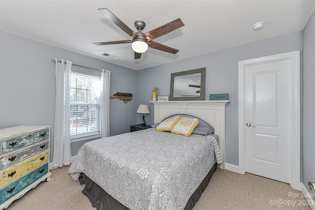 21311 Summerbrook Drive Cornelius, NC 28031 - Photo 22 of 28 a bedroom with a bed and a window
