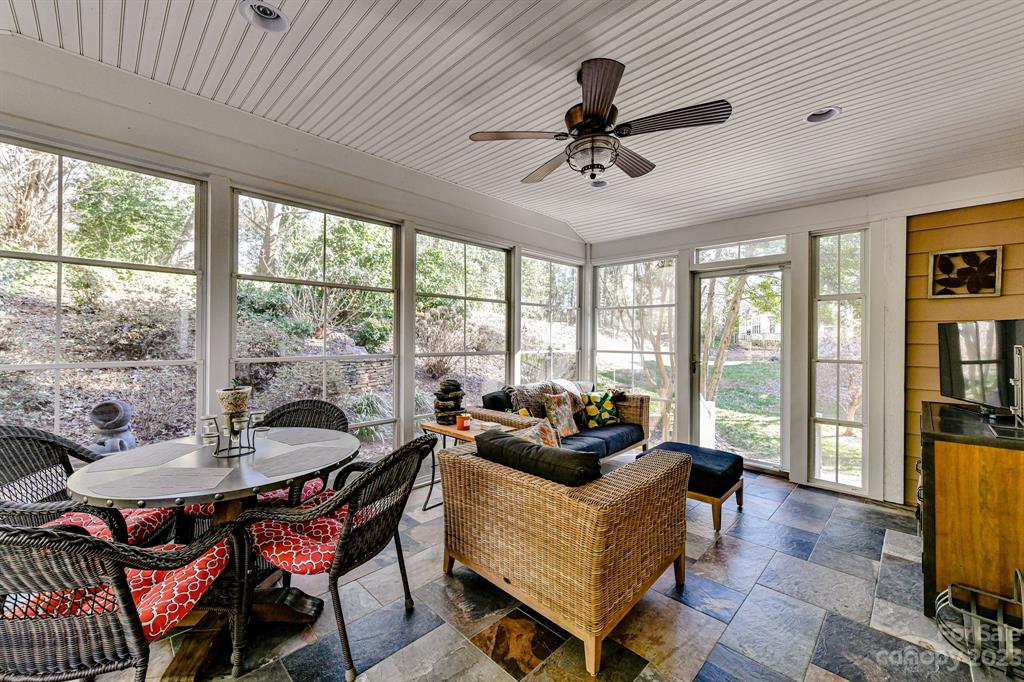 21311 Summerbrook Drive Cornelius, NC 28031 - Photo 25 of 28 a living room with furniture and a floor to ceiling window