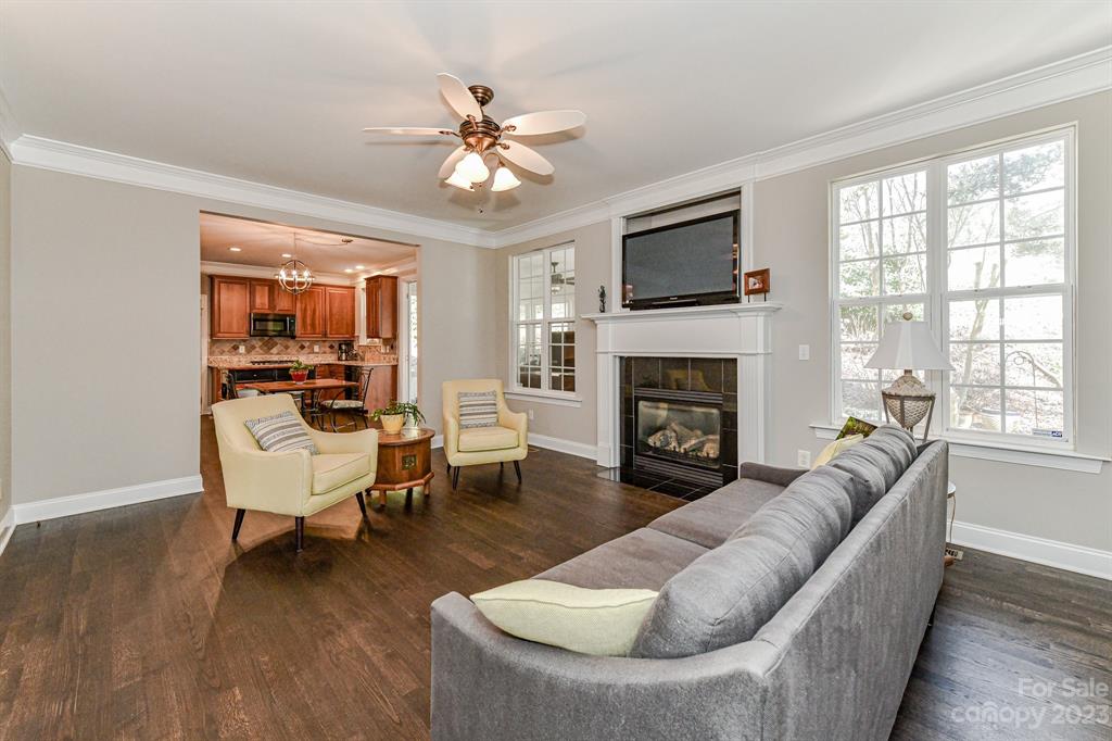 21311 Summerbrook Drive Cornelius, NC 28031 - Photo 7 of 28 a living room with furniture and a fireplace