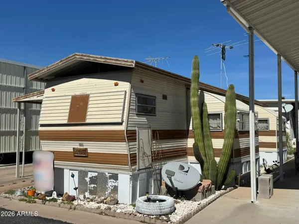 a front view of a house with outdoor space