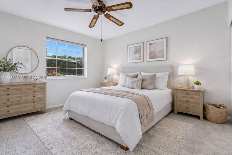 22065 Palm Grass Drive Boca Raton, FL 33428 - Photo 21 of 46 a bedroom with a bed and a dresser