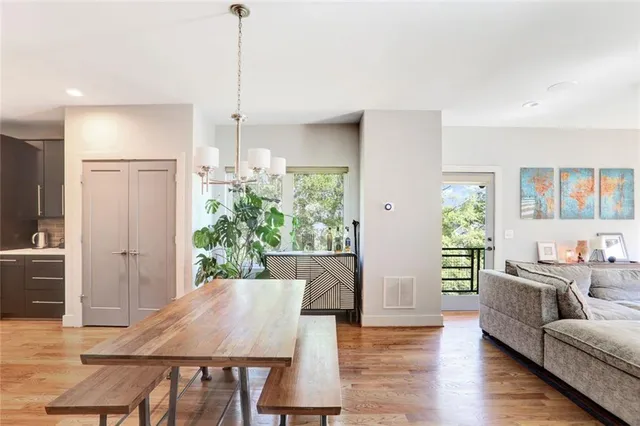 a view of a dining room with furniture window and wooden floor