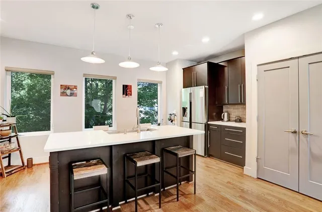 a bedroom with bed and a potted plant