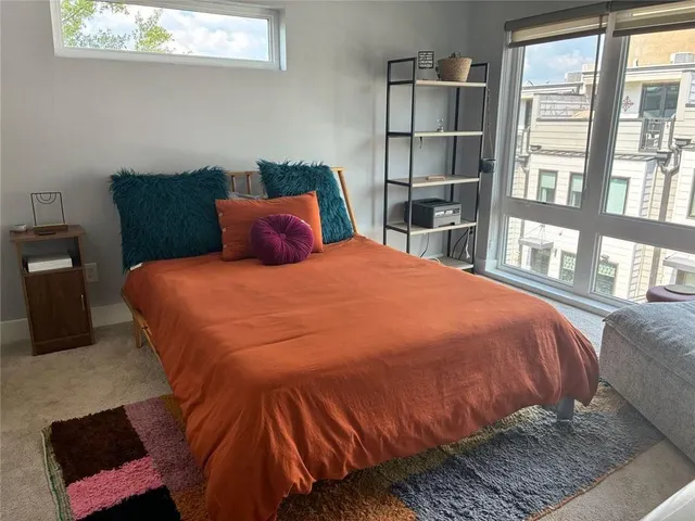 a bathroom with a sink a toilet and a shower curtain