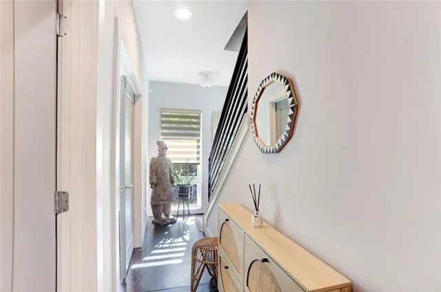 a view of a livingroom with furniture and entryway
