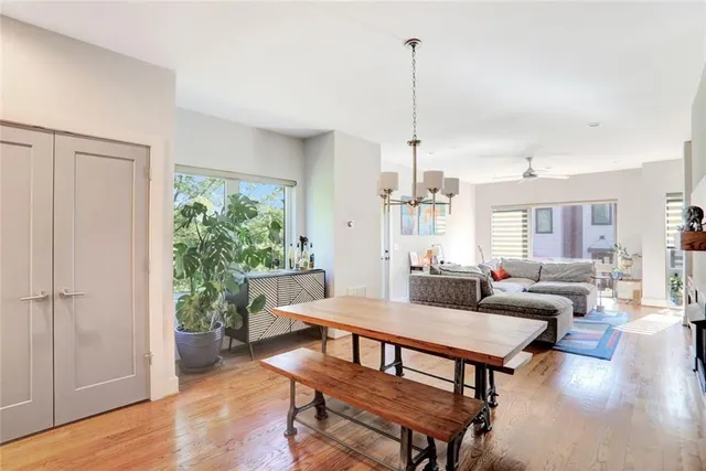 a view of a livingroom with furniture window and wooden floor