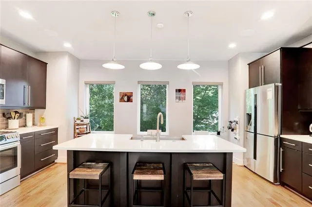 a kitchen with a table and chairs