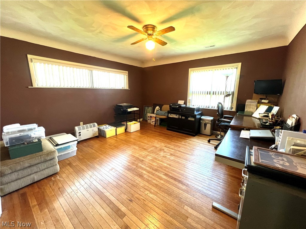 4663 East Harbor Road Port Clinton, OH 43452 - Photo 24 of 31 Living room featuring light hardwood / wood-style floors and ceiling fan