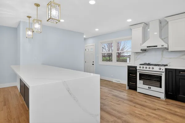 a kitchen with stainless steel appliances a stove oven and a refrigerator