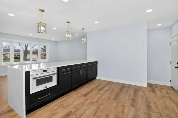 a kitchen with a stove and a sink