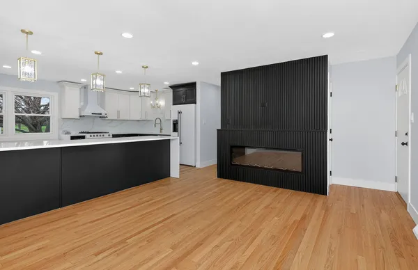 a kitchen with stainless steel appliances granite countertop a refrigerator and a sink
