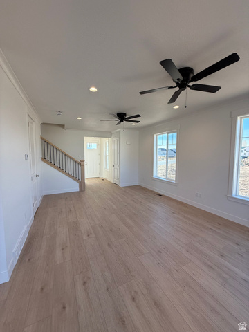 1142 West 220 North Mapleton, UT 84664 - Photo 7 of 26 Unfurnished living room featuring light wood-type flooring, ornamental molding, recessed lighting, and ceiling fan