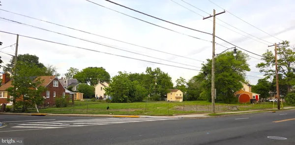 a view of a tall white house