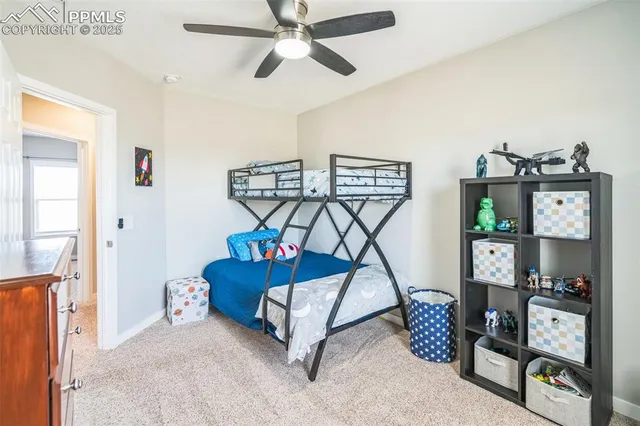 a living room with lots of furniture and a wooden floor