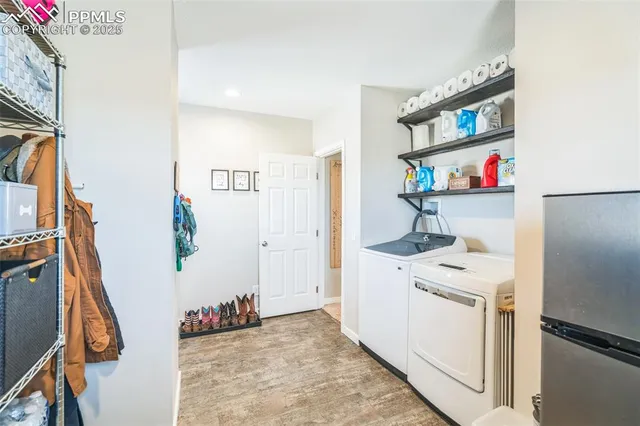 a view of kitchen with furniture and wooden floor