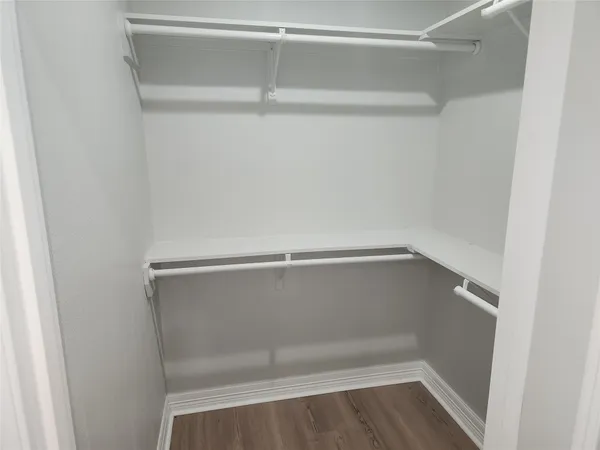 a view of an empty walk in closet