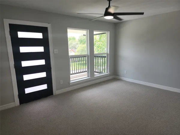 a view of an empty room with a window