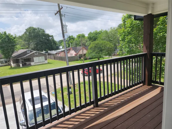 a view of balcony with furniture