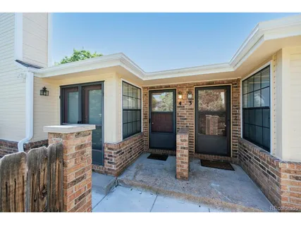 a view of an entryway with wooden floor