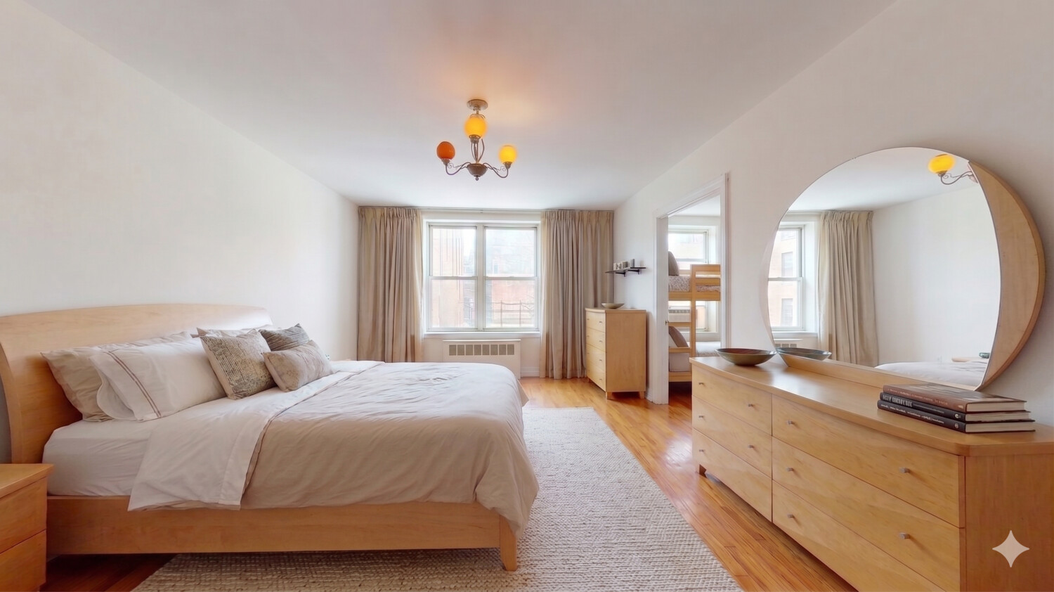 1200 Gravesend Neck Road, Unit 3L Brooklyn, NY 11229 - Photo 4 of 10 a bedroom with a bed and wooden floor