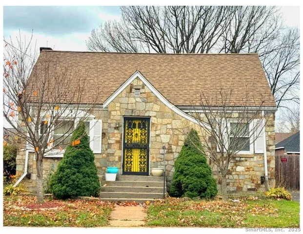 a view of a brick house with large windows