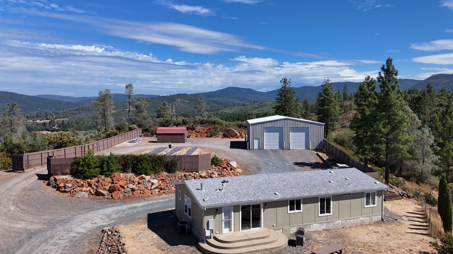 a front view of a house with a yard and balcony