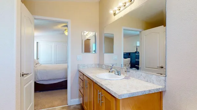 a bathroom with a sink and a mirror