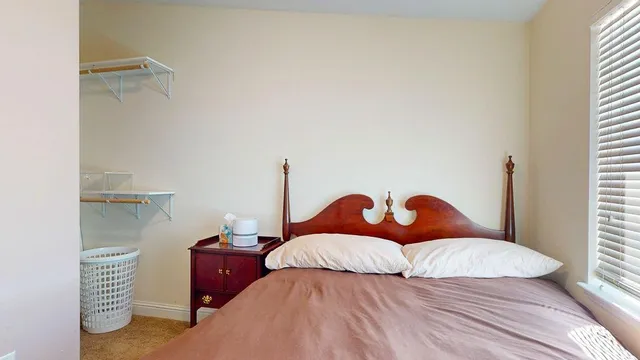 a view of kitchen with stainless steel appliances granite countertop wooden floor dining table and chairs