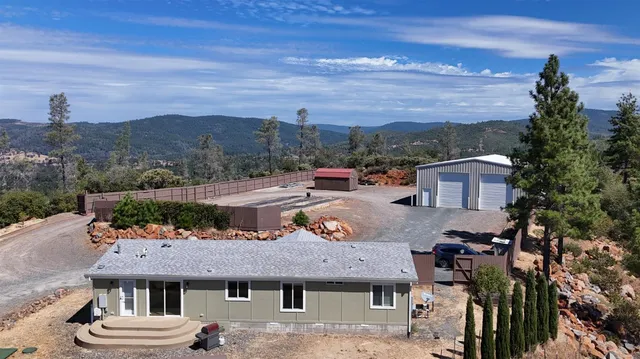 a view of a city with mountains in the background