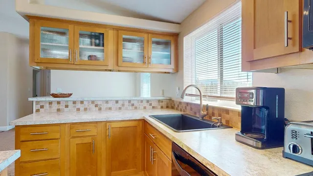 a bath tub sitting in a bathroom next to a sink