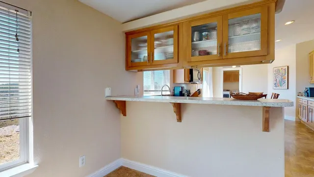 a bathroom with a shower and a sink