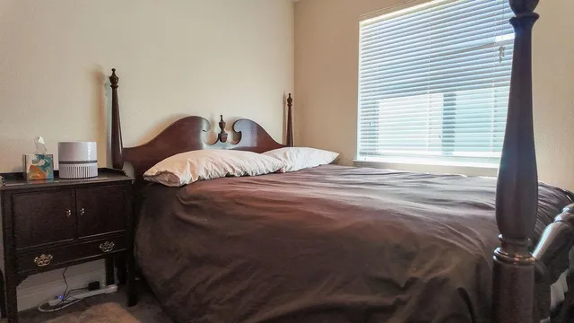 a bathroom with a white wall