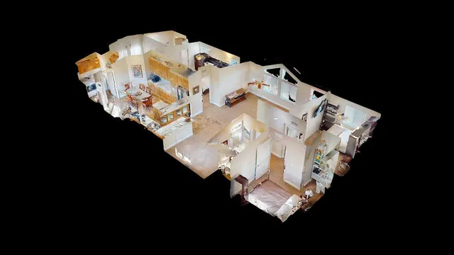 a view of kitchen with furniture and a refrigerator