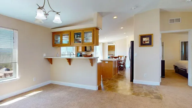 a bedroom with a bed and a mirror