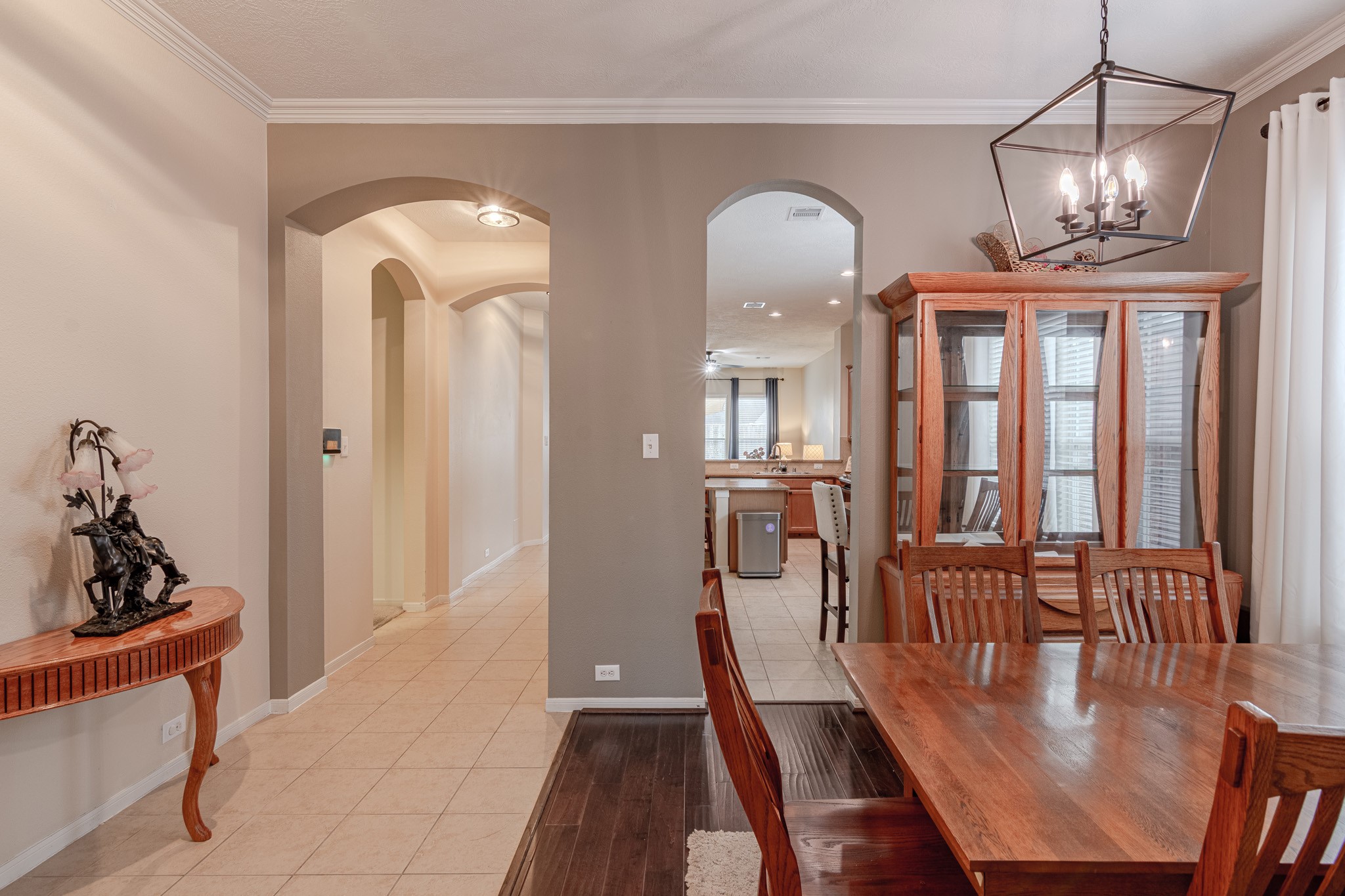 2954 Smokey Forest Lane Spring, TX 77386 - Photo 11 of 40 a view of a dining room with furniture a chandelier and wooden floor