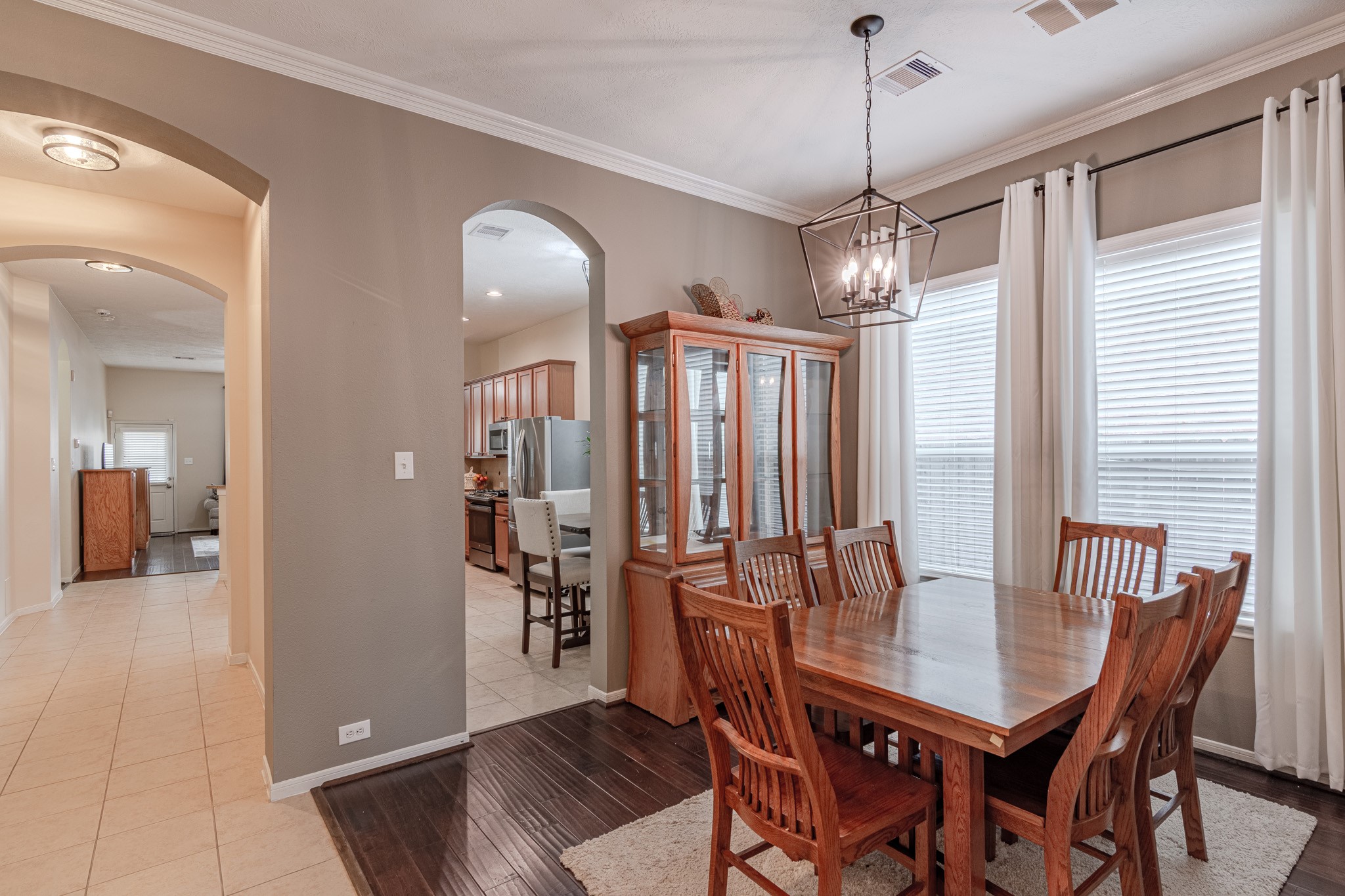 2954 Smokey Forest Lane Spring, TX 77386 - Photo 12 of 40 a view of a dining room with furniture window and wooden floor