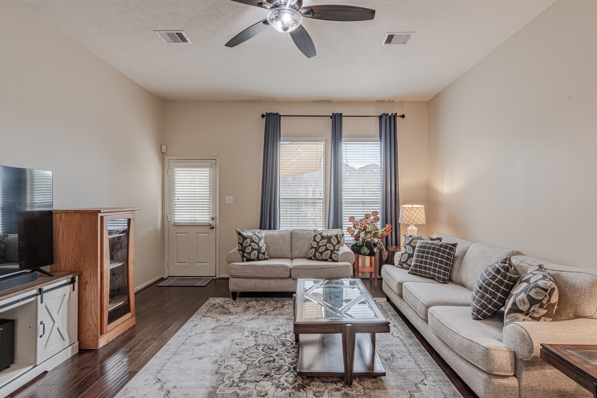 2954 Smokey Forest Lane Spring, TX 77386 - Photo 20 of 40 a living room with furniture and a flat screen tv