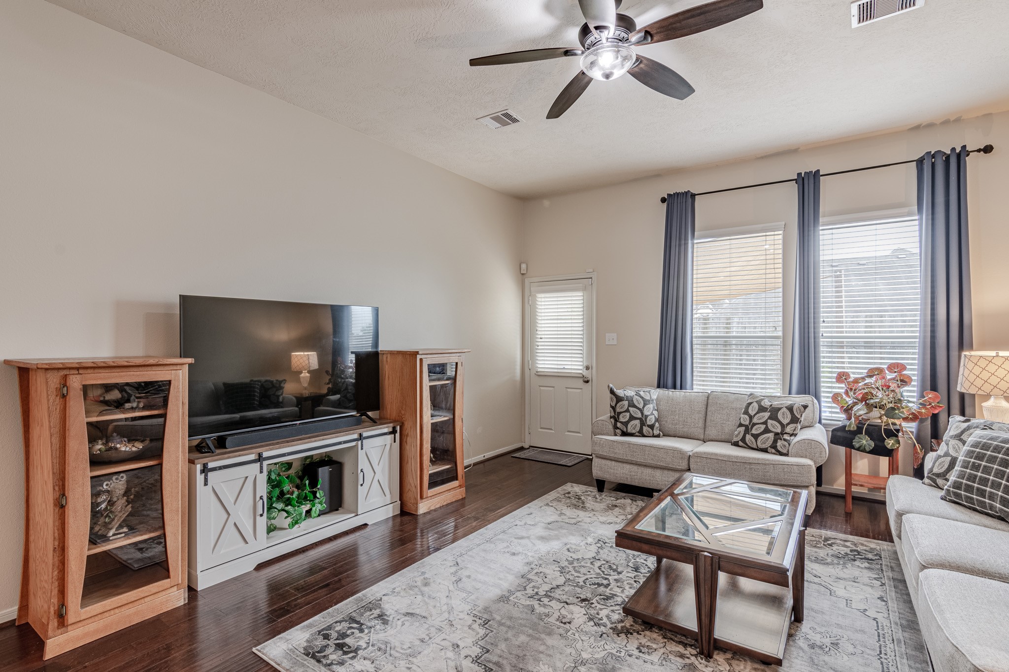 2954 Smokey Forest Lane Spring, TX 77386 - Photo 21 of 40 a living room with furniture a flat screen tv and a fireplace
