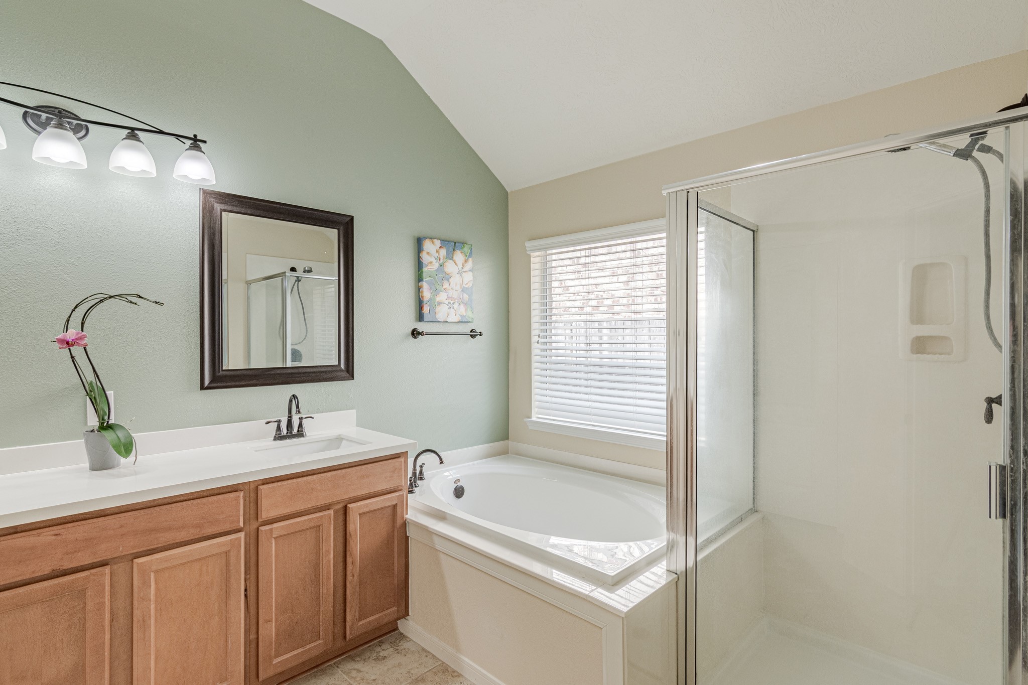 2954 Smokey Forest Lane Spring, TX 77386 - Photo 28 of 40 a bathroom with a tub a sink and mirror